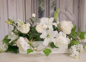 Wedding table flowers of white lilac, peonies and roses