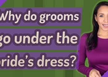 Why do grooms go under the bride's dress?