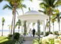 Couple exchanging vows in the oceanfront wedding gazebo at Hyatt Ziva Los Cabos