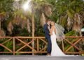 Real couple embracing on their wedding day at The Grand at Moon Palace Resort Cancun
