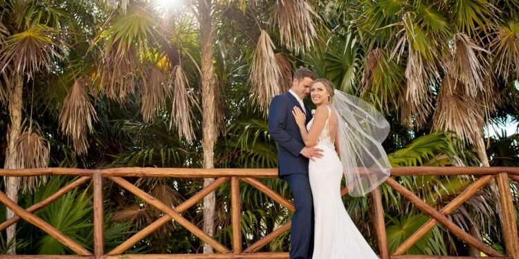 Real couple embracing on their wedding day at The Grand at Moon Palace Resort Cancun