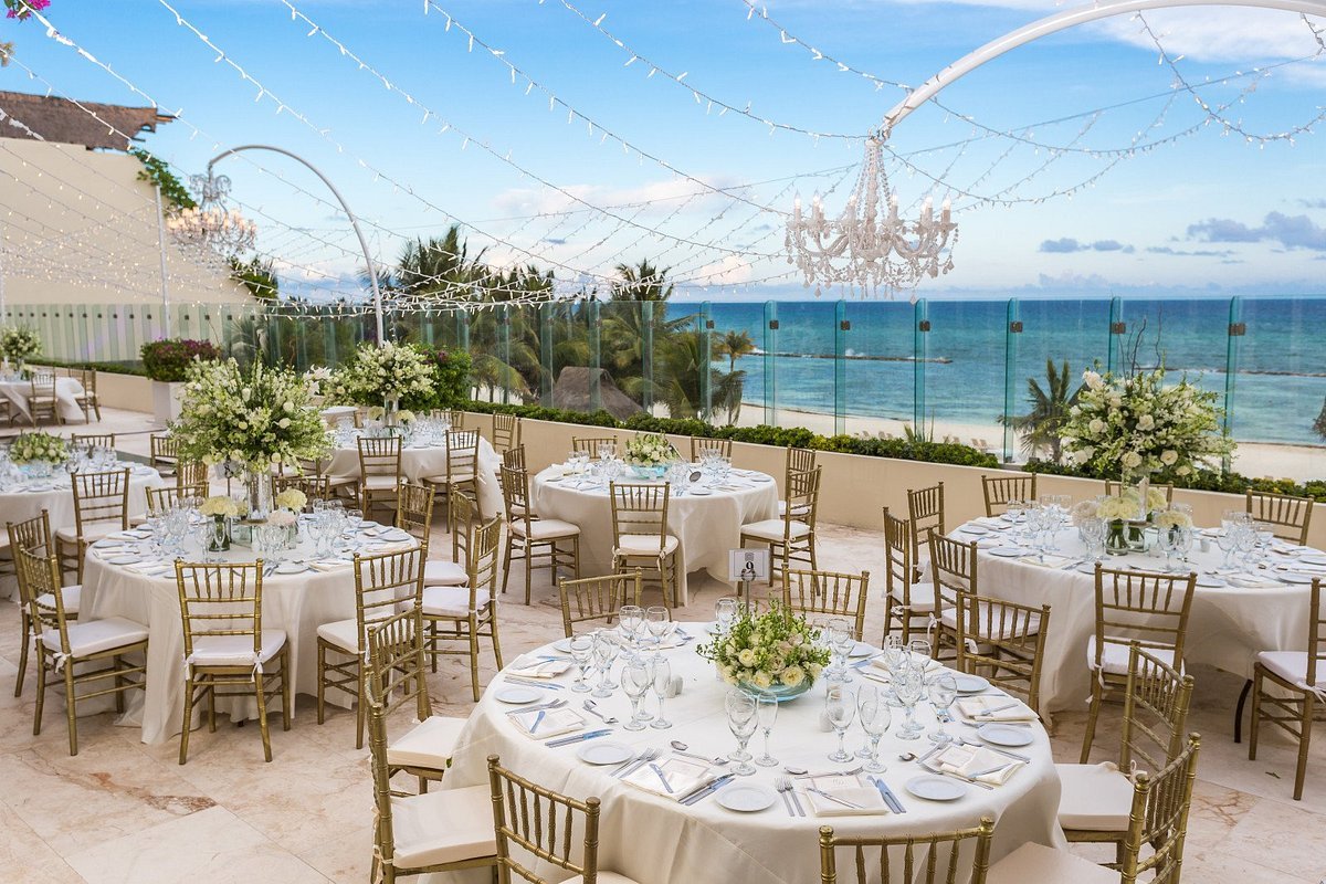 Terrace wedding reception overlooking the ocean at Grand Velas Riviera Maya
