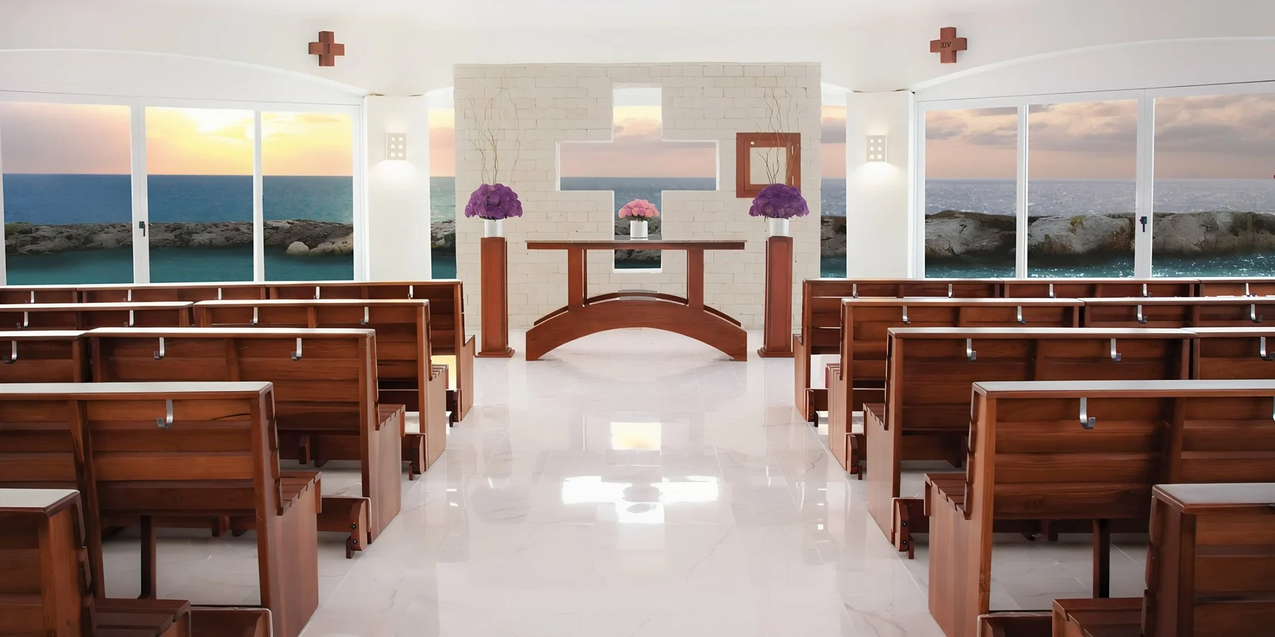 Interior of the San Charbel Chapel at Hard Rock Riviera Maya, with wooden pews facing a stone altar wall carved with a cross, floor-to-ceiling windows onto the Caribbean, and numbered Stations of the Cross mounted on the side walls
