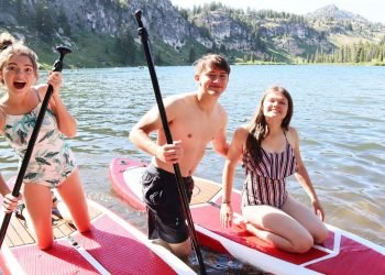 Taking A Break From Wedding Planning To Go Paddle Boarding At The Lake