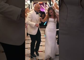 Newlyweds Dancing Exit with Big Ric Rising Wedding Band