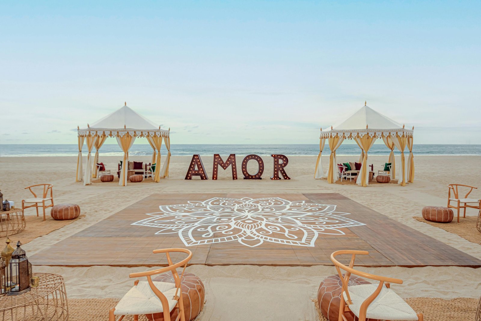 Sangeet stage setup on the beach with draping and seating at Hyatt Ziva Los Cabos
