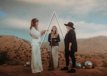 couple exchanging vows in Airbnb backyard