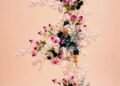 Cascading pink and blue floral wedding arrangement in a pastel garden setting